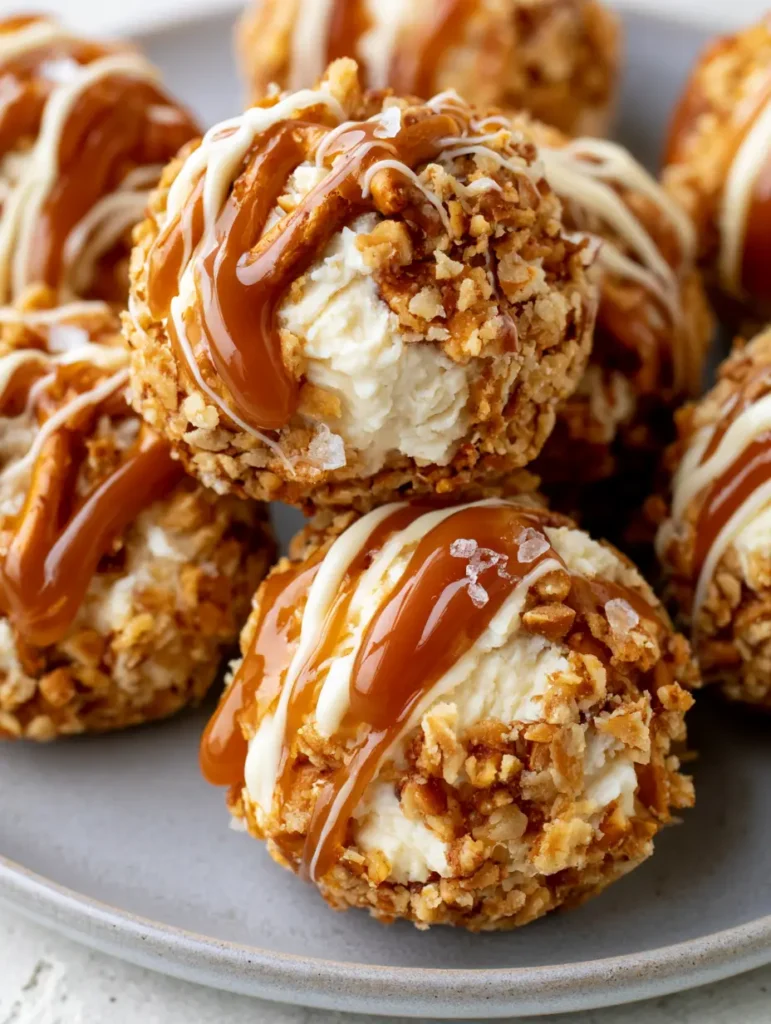 Close-up shot of golden-brown crushed pretzel coating on Salted Caramel Pretzel Cheesecake Bites.