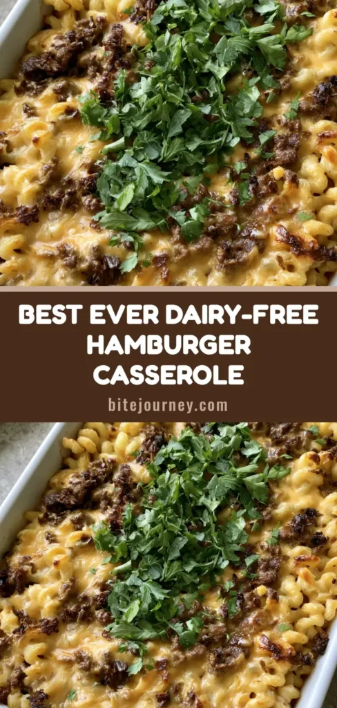 A close-up shot of a Dairy-Free Hamburger Casserole in a white dish, showing rotini pasta and browned beef in a creamy orange sauce garnished with parsley.